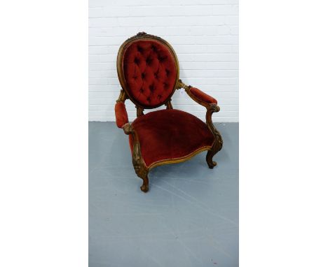 A 19th century mahogany framed button back lounge chair having a moulded top rail above padded back and arm supports over stu