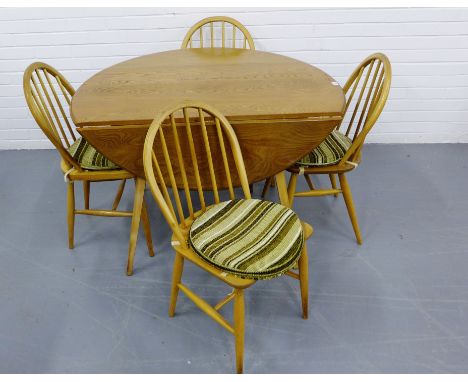 A retro light wood Ercol table and four chairs, 114 x 73cm