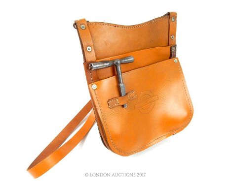 A vintage London Transport Bus satchel with key.