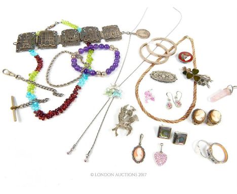 An assortment of white metal, sterling silver and gem-set jewellery to include a vintage, hinged five-panel bracelet depictin