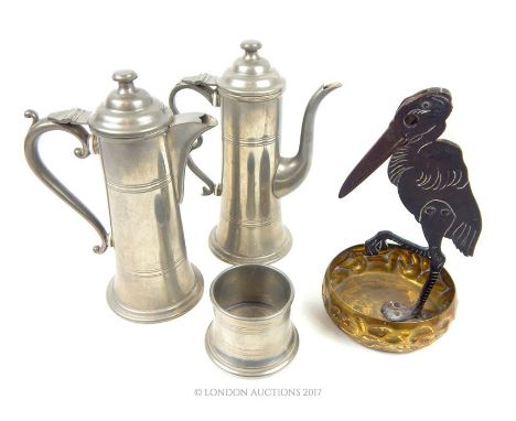 A vintage cigar cutter in the form of a stork with fitted brass tray together with a three pieces pewter: coffee pot; tea pot