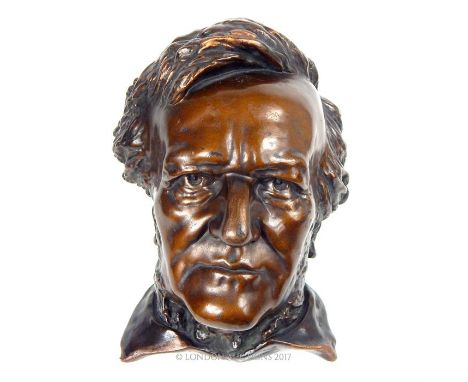 A bronzed ceramic cast bust of Wagner; 30cm long,