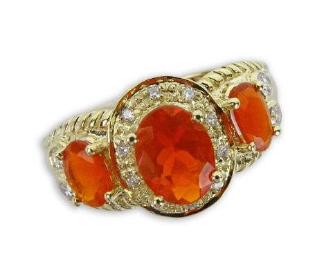 Approx. 1.37 Carat Fire Opal, .75 Carat Round Cut Diamond and 14 Karat Yellow Gold Three Stone Ring. Opals with vivid saturat