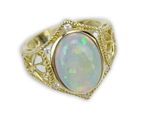 Approx. 4.03 Carat White Opal, Diamond and 14 Karat Yellow Gold Ring. Signed 14K. Very good condition. Ring size 7. Approx. w