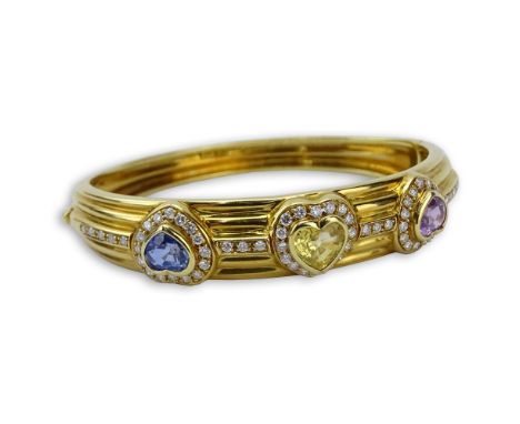 Vintage French 18 Karat Yellow Gold Bangle Bracelet set with Pink, Yellow and Purple Heart Shape Sapphires and accented throu