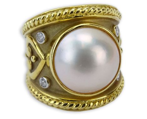 Vintage 18 Karat Yellow Gold and Mabe Pearl Ring accented with Single Cut Diamonds. Pearl measures 13.5mm diam. Signed 750. G