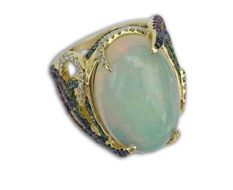 Approx. 11.31 Carat White Opal and 14 Karat Yellow Gold Ring accented throughout with Round Cut Diamonds, Sapphires and Green