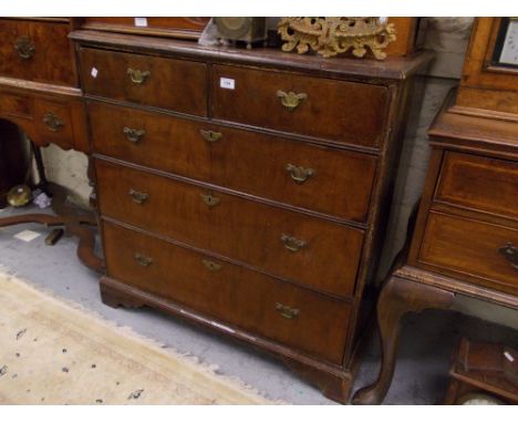 Early 18th Century walnut chest, the crossbanded and moulded top above two short and three long drawers with original brass h