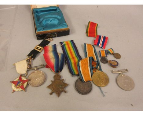 Africa Service medal, a '39 / '45 medal, three World War I medals, all to the Saunders family, together with other badges and