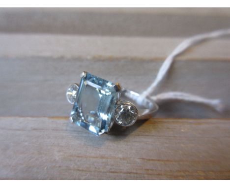 Aquamarine and two stone diamond set ring, the aquamarine of approximately 3ct, the round brilliant cut diamonds of approxima