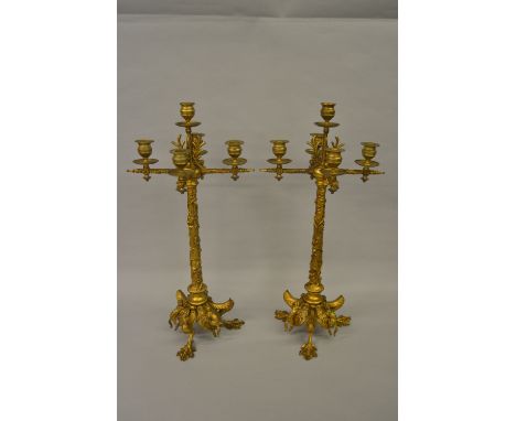 Jules Moigniez, pair of 19th Century French gilt bronze five light candelabra, the tapering stems relief decorated with trail