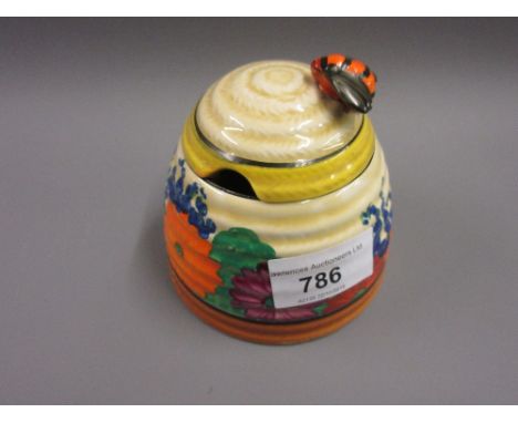 Clarice Cliff ' Gay Day ' beehive form floral painted preserve jar with coverFinial has been off and restored 