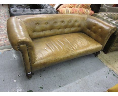 Small late 19th Century green button upholstered leather Chesterfield sofa, on turned front supports64ins wide x 30ins deep x