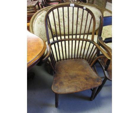 George III oak and elm stick back Windsor armchair with a shaped panel seat raised on turned supports with crinoline stretche