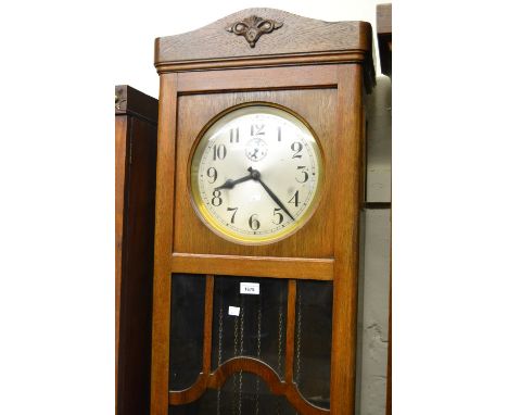 Early to mid 20th Century Continental oak longcase clock, the silvered dial with Arabic numerals and subsidiary seconds with 