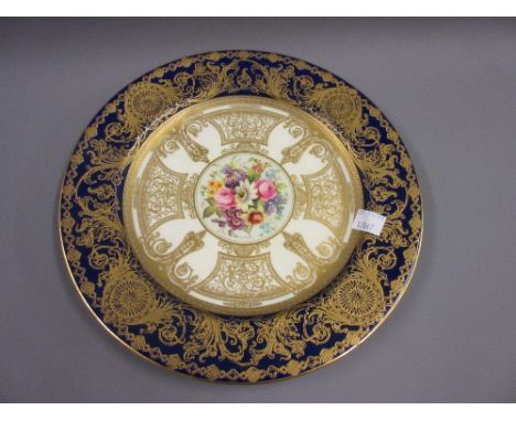 Royal Worcester cabinet plate with floral painted centre panel, signed E. Phillips 