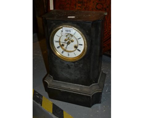 Large 19th Century French black slate mantel clock, the circular white enamel dial with Roman numerals and visible escapement
