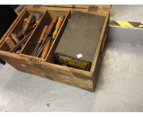 Carpenter's tool chest containing a collection of carpentry tools 