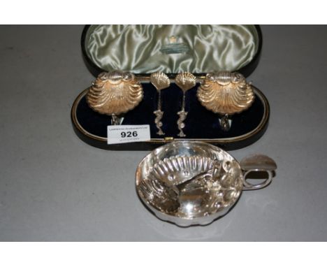 Cased pair of silver shell form salts with spoons, together with a plated tasse de vin and a white metal caddy spoon 