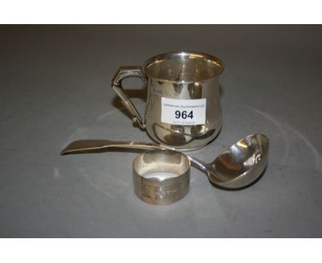 Sheffield silver Christening mug, a silver napkin ring and a 19th Century silver ladle 