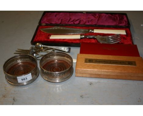 Pair of London silver and turned wooden glass coasters, a silver sugar sifter spoon, four items of plated flatware, cased pla