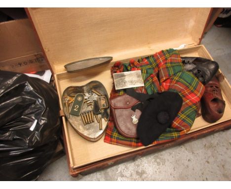 Canvas trunk containing Sutherland Highlanders uniform including: kilts, badges and other various itemsThere are four kilts. 