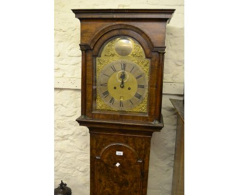 18th Century walnut longcase clock, the moulded broken arch hood with flanking pilasters above an arched moulded and crossban