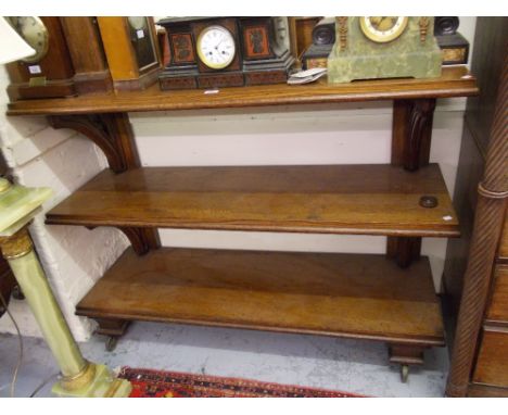 Good quality 19th Century oak three tier buffet of Gothic Revival design, the shaped and carved back above three moulded shel