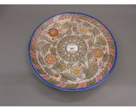 Crown Ducal Charlotte Rhead circular pottery charger with tube lined floral decoration, 12.5ins diameter 