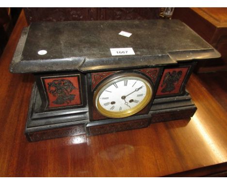 19th Century French black slate and rouge marble mantel clock, the case decorated with figures of winged angels, the circular