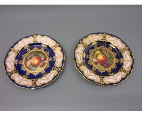 Two Royal Worcester plates painted with panels of fruit by Seabright (with damages) 