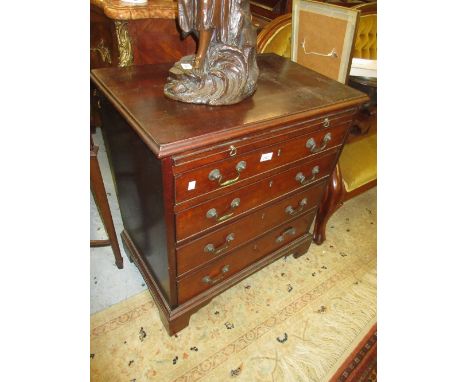 Mahogany dwarf chest with a brushing slide above four graduated drawers with brass handles raised on bracket feet 