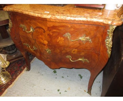 Early 20th Century French kingwood floral marquetry inlaid ormolu mounted commode, the shaped marble top above two drawers ra