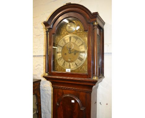 George III mahogany longcase clock, the arched hood flanked by turned columns above an arched door, the gilded and silvered d