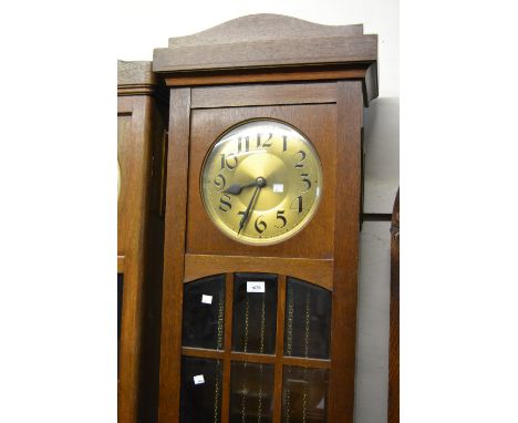 Early to mid 20th Century Continental oak longcase clock, the brass dial with Arabic numerals and three train weight driven m