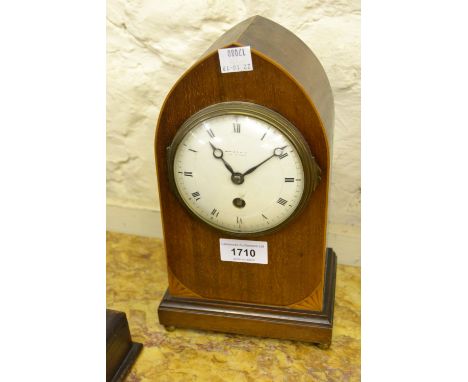 Edwardian mahogany and boxwood line inlaid lancet shaped mantel clock with an enamel dial, Roman numerals and single train mo