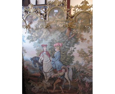 Brass framed floor standing machine woven tapestry of figures on horseback mounted with gilt metal coat hooks, 72ins high x 4