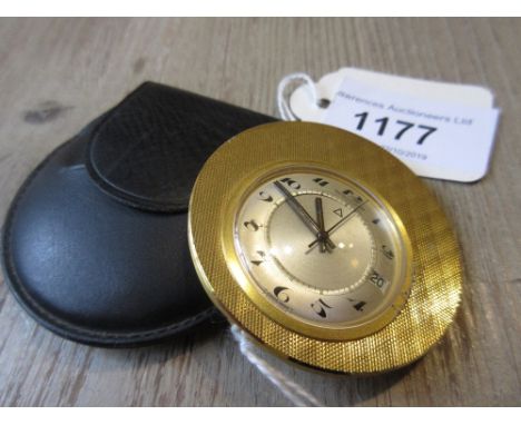 Jaeger le Coultre, mid 20th Century travel watch, the engine turned gilt brass case enclosing a circular silvered dial with A