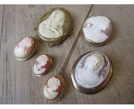 Two carved shell cameo portrait brooches in yellow metal mounts, together with a small cameo pendant and two other shell came