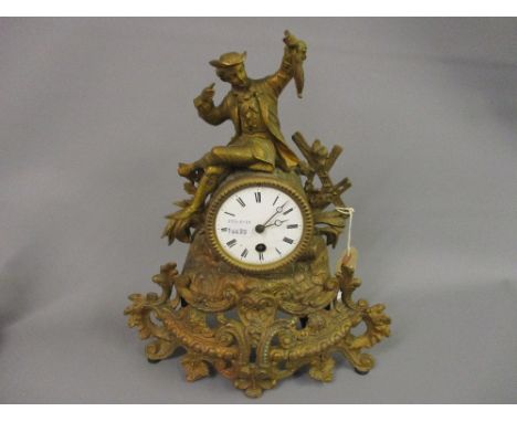 Small 19th Century gilded spelter mantel clock with figural surmount, the enamel dial with Roman numerals and single train mo