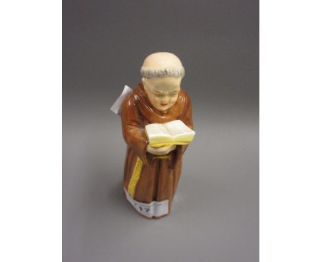 Royal Worcester candle snuffer in the form of a monk reading from a book 