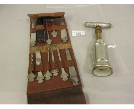 Late 20th Century brass and metal double action corkscrew and a small leather case of hand tools 