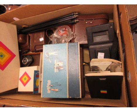Two 35mm cameras, polaroid camera and a pair of binoculars 