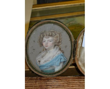 18th / 19th Century watercolour portrait miniature of a girl wearing pearl jewellery and a blue dress in a contemporary green