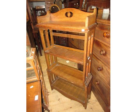 Early 20th Century Arts and Crafts four shelf open bookcase with pierced sides, stamped with registration number to the rever