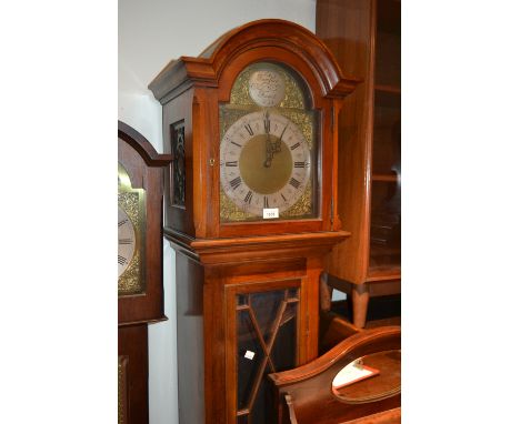 Mid 20th Century mahogany longcase clock with an arched hood above glazed door, raised on bracket feet, the silvered and bras