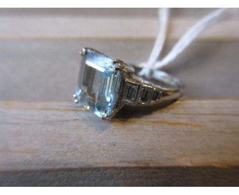 Art Deco style aquamarine ring, the shoulders set with graduated baguette diamonds, the aquamarine of approximately 3ct, the 