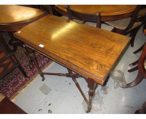 Edwardian rosewood and line inlaid rectangular fold-over card table on baluster turned supports with a crossover stretcher 