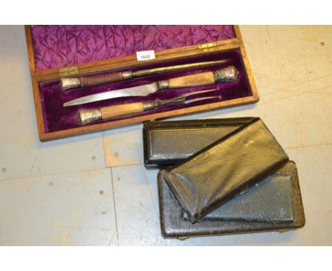 Continental silver four piece cutlery set in fitted case, a three piece horn handled carving set and five cased sets of plate