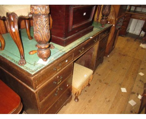 Early 20th Century mahogany twin pedestal desk with leather inset top above eight drawers with brass swan neck handles and br